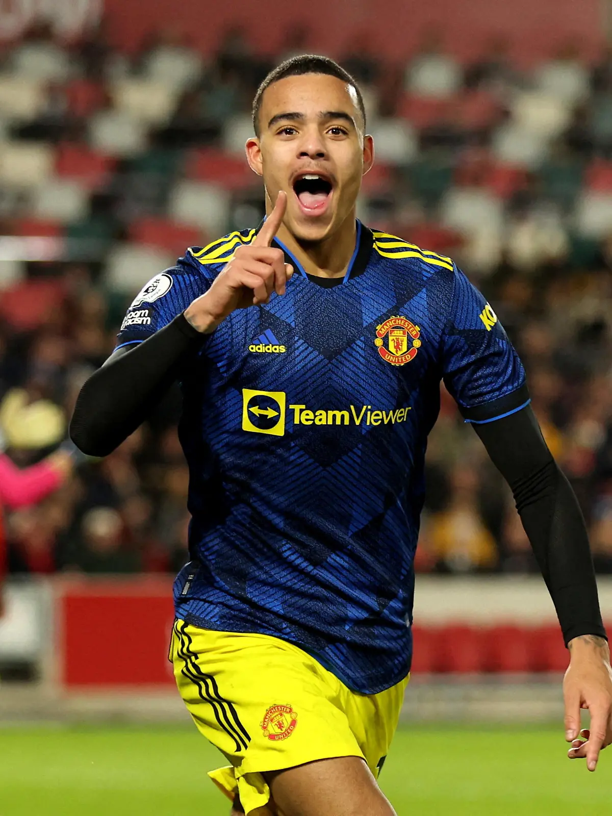 FILE PHOTO: Soccer Football - Premier League - Brentford v Manchester United - Brentford Community Stadium, London, Britain - January 19, 2022 Manchester United's Mason Greenwood celebrates scoring their second goal REUTERS/Ian Walton/File Photo EDITORIAL USE ONLY. No use with unauthorized audio, video, data, fixture lists, club/league logos or 'live' services. Online in-match use limited to 75 images, no video emulation. No use in betting, games or single club /league/player publications.  Please contact your account representative for further details.