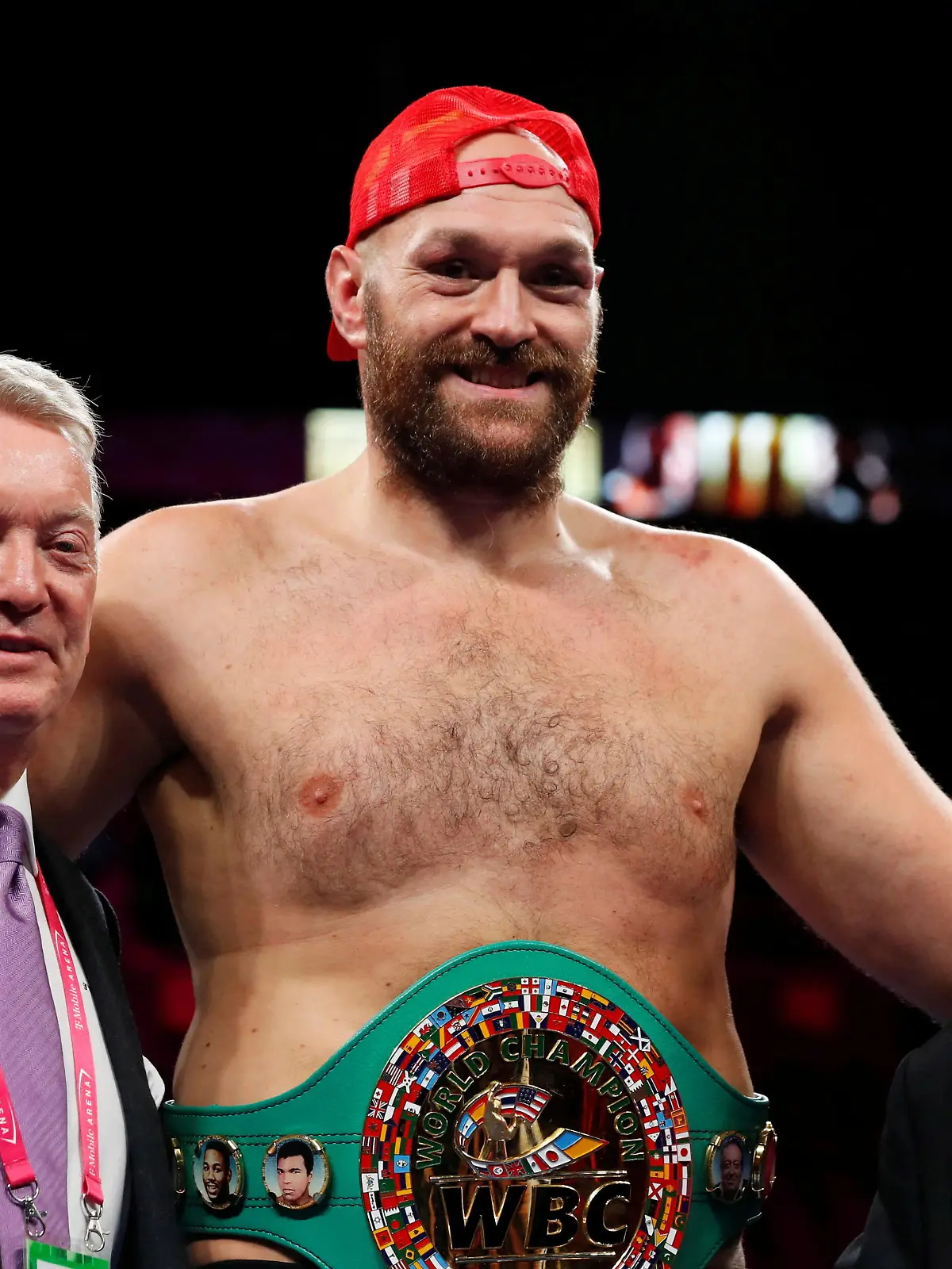 FILE PHOTO: Boxing - Tyson Fury v Deontay Wilder - WBC Heavyweight Title - T-Mobile Arena, Las Vegas, Nevada, U.S. - October 9, 2021 Tyson Fury poses for a photograph with promoters Frank Warren and Bob Arum during a press conference after winning the fight against Deontay Wilder REUTERS/Steve Marcus/File Photo