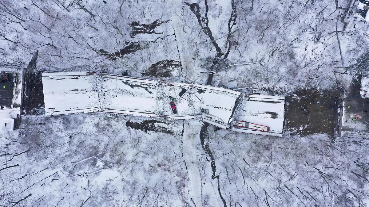 Damaged vehicles are seen at the site of a collapsed bridge in Pittsburgh, Pennsylvania, U.S., January 28, 2022. Picture taken with a drone. REUTERS/Drone Base