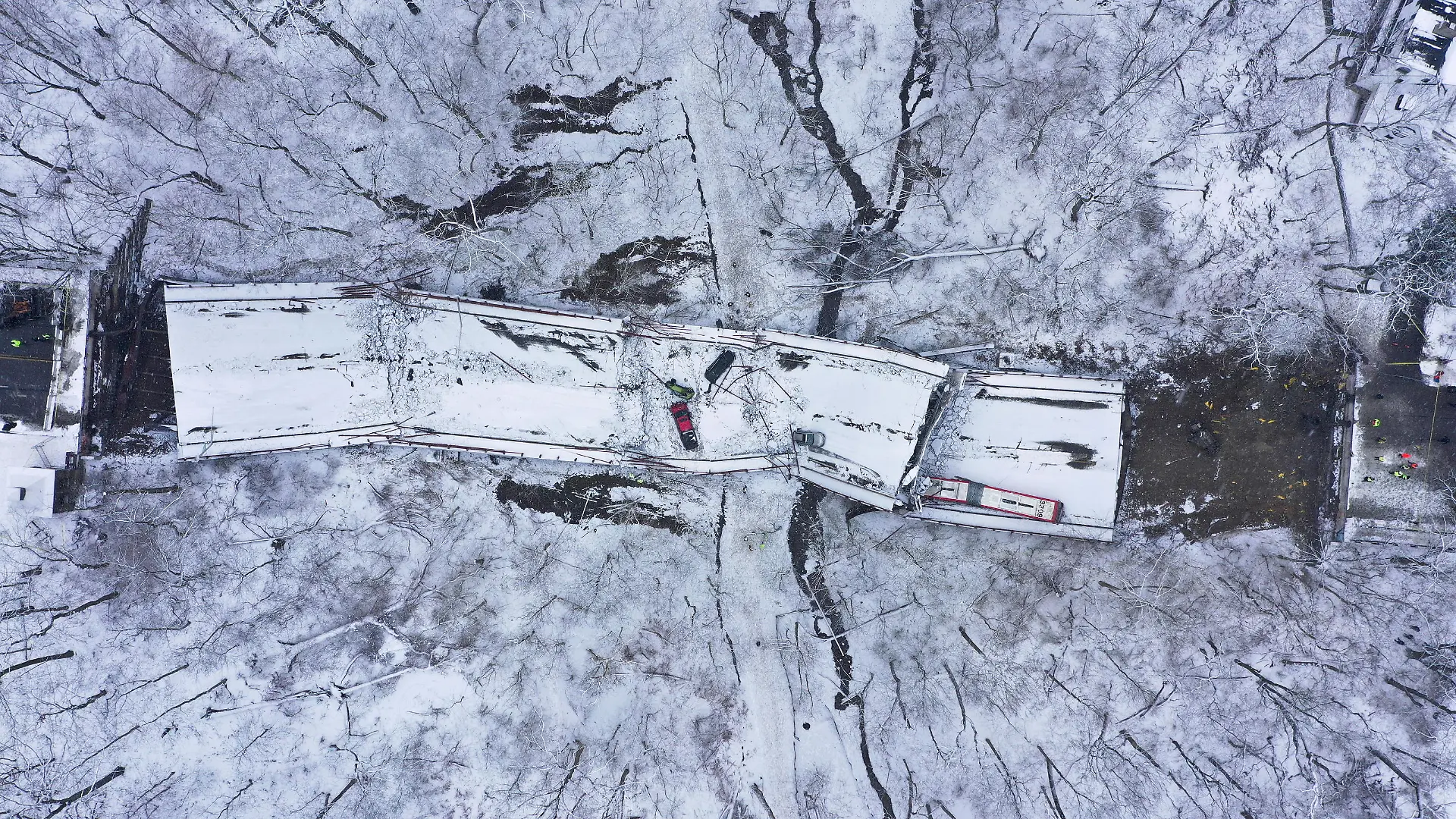 Damaged vehicles are seen at the site of a collapsed bridge in Pittsburgh, Pennsylvania, U.S., January 28, 2022. Picture taken with a drone. REUTERS/Drone Base