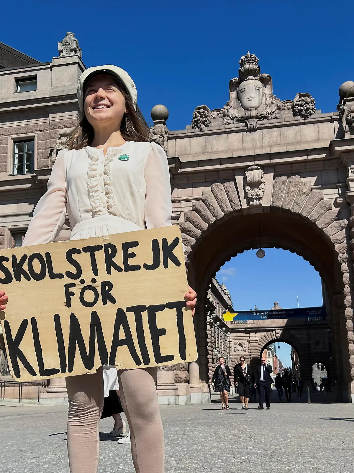 Greta Thunberg stands with a sign that reads, "School Strike for climate", outside the Swedish Parliament on the day of her weekly protest in Stockholm, Sweden, June 9, 2023. REUTERS/Marie Mannes