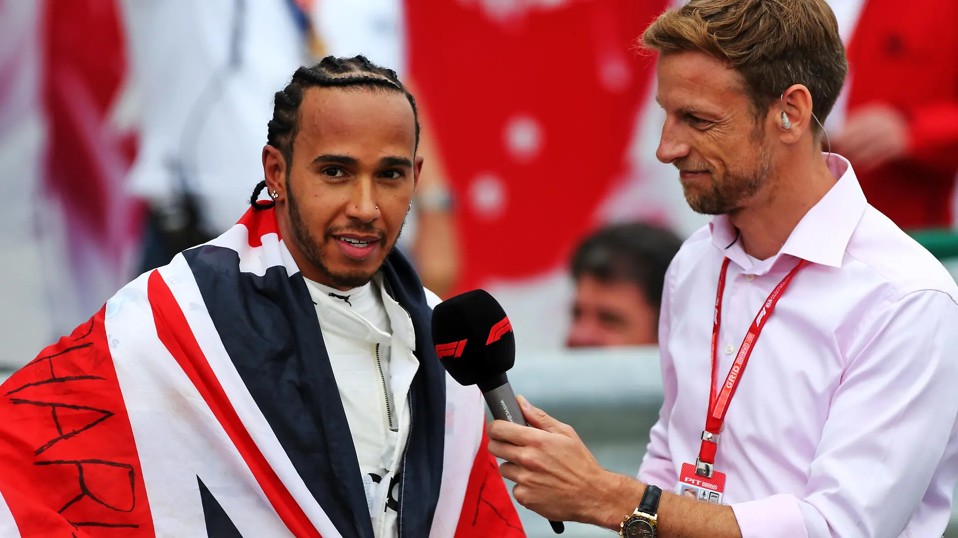 British Grand Prix - Race - Silverstone. Race winner Lewis Hamilton (GBR) Mercedes AMG F1 in parc ferme with Jenson Button (GBR) Sky Sports F1 Presenter. British Grand Prix, Sunday 14th July 2019. Silverstone, England. URN:44106996