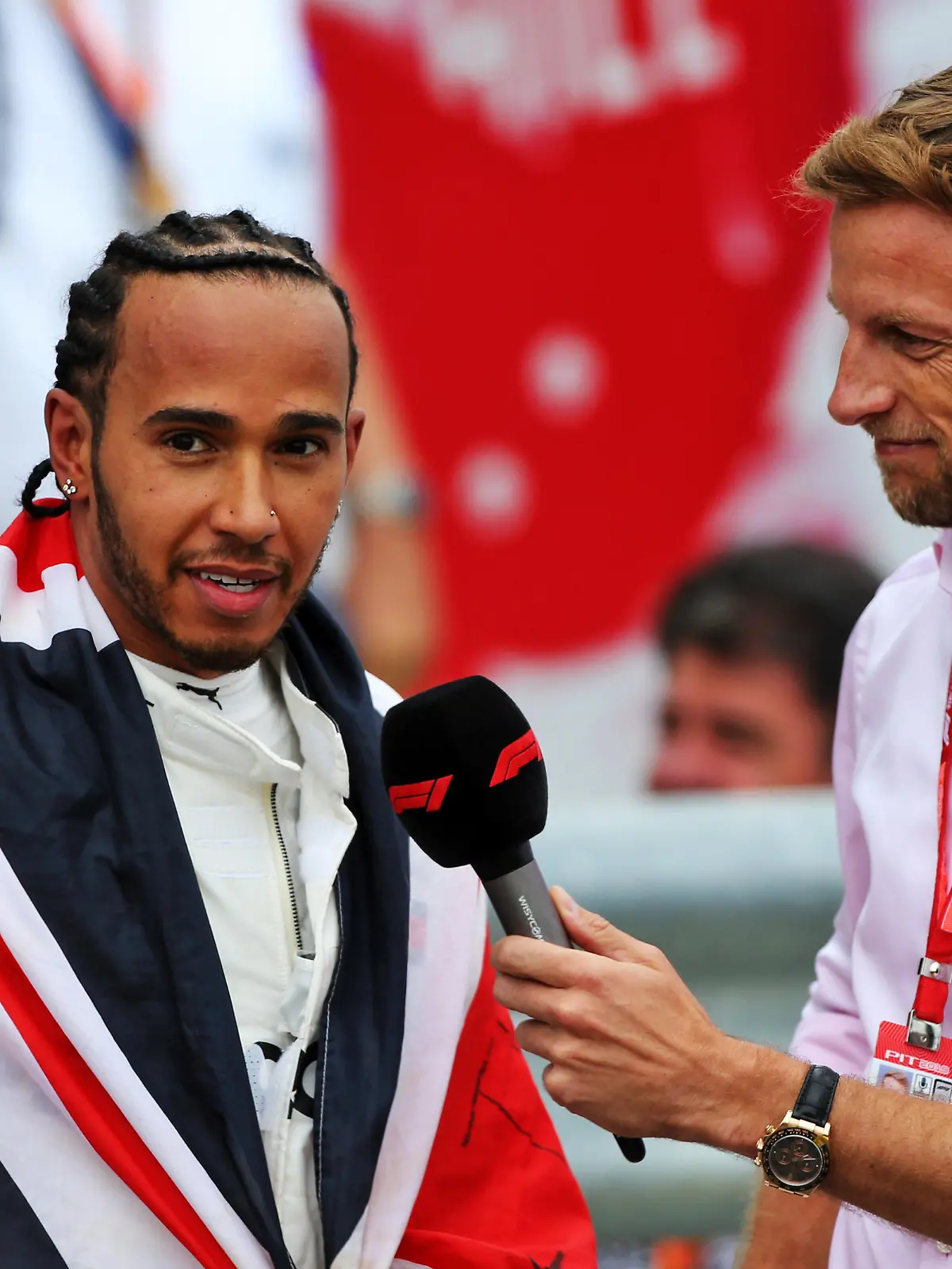 British Grand Prix - Race - Silverstone. Race winner Lewis Hamilton (GBR) Mercedes AMG F1 in parc ferme with Jenson Button (GBR) Sky Sports F1 Presenter. British Grand Prix, Sunday 14th July 2019. Silverstone, England. URN:44106996