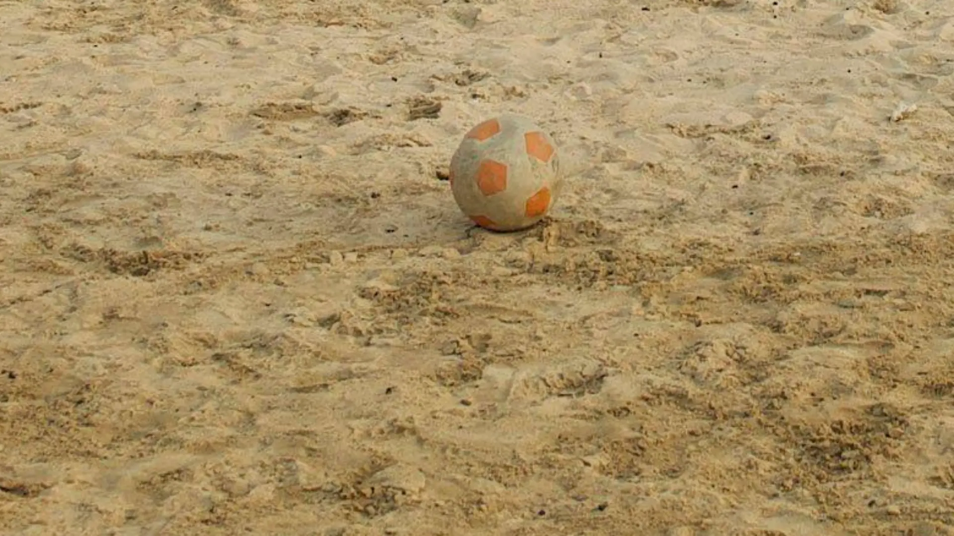 Children play soccer (football) on sandy beach behind the West Point slum in Monrovia, the capital of Liberia. The West Point Township or slum in Monrovia houses over 70,000 people. It is known to be one of the most dangerous slums in Monrovia. Water and sanitation condition in the slum is certainly less that adequate. Due to the lack of sanitary latrines, it is common for many residents of the West Point to defecate in open near the beach. It is also common for people to dispose of garbage on the beach that continues to create health hazards for its residents. In recent times, Liberia continues to recover from a ruinous 14-year civil war that ended in 2003. Although the Government is working to rebuild the countryÄôs destroyed infrastructure, many Liberians still live without access to basic services. The influx of approximately 178,000 refugees from Cv¥te d'Ivoire, who fled their own country after controversy surrounding the 28 November 2010 presidential election turned violent, has only exacerbated the situation. Waning supplies of safe drinking water and food, inadequate sanitation facilities, constricted access to medical care and overcrowding all threaten the health of Liberian and Ivorian children alike. The education of many children has also been disrupted because refugees stay in schools when there are not enough families to host them. The poor condition of roads makes it difficult for aid to reach remote areas, where many of the most vulnerable families live. Many of the refugees have returned home, but thousands have stayed back, often hosted by Liberian communities and families, both in rural and urban areas of the country. NGOs and the Liberian Government continue to work hard to provide life-saving services for both Liberian citizens and Ivorian refugees.