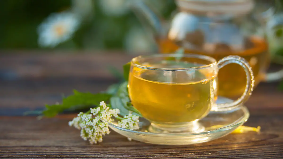Crystal cup with green tea on a table