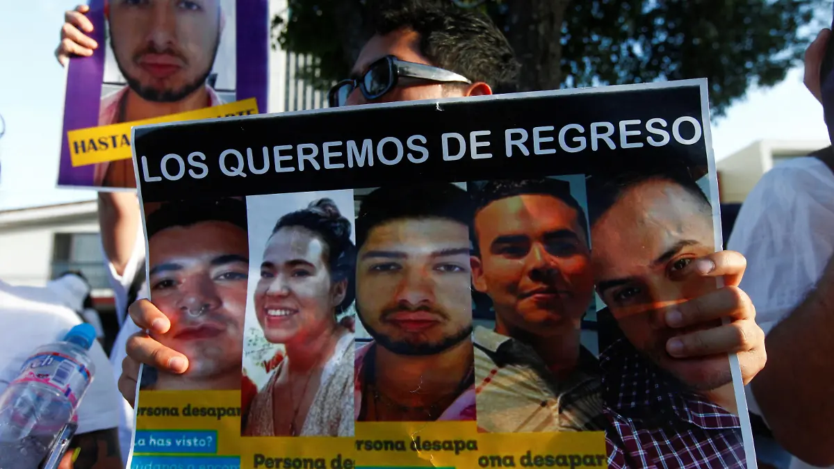 Friends and relatives hold banners with images of several missing call center employees, as they take part in a protest to demand justice from the city government along the streets in Guadalajara, Mexico June 2, 2023. REUTERS/Fernando Carranza
