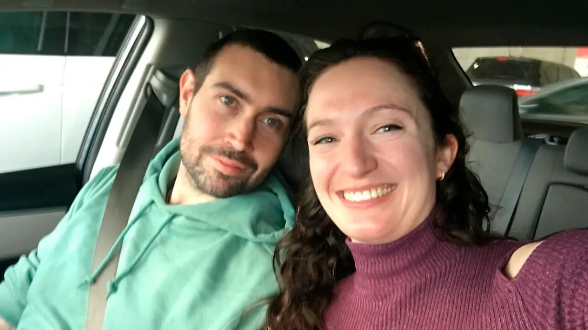 This undated photo provided by Brookhaven Police Dept. shows Matthew Willson, 31, of Chertsey, Surrey, England, with his girlfriend Katherine Shepard.   A stray bullet struck and killed Wilson, an English astrophysicist, while he was inside an Atlanta-area apartment on Sunday, Jan. 16, 2022. Police say the death was the result of “reckless” gunfire by random individuals. (Brookhaven Police Dept via AP)