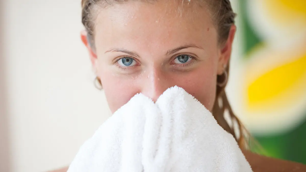 Woman holding towel
