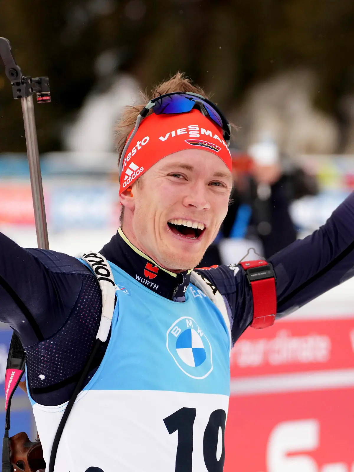 Benedikt Doll of Germany reacts after crossing the finish line during the men's 15km mass start race at the biathlon World Cup in Anterselva, Italy, Saturday, Jan. 22, 2022. (AP Photo/Matthias Schrader)