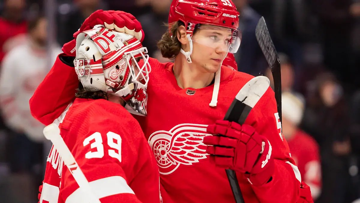 Jan 15, 2022; Detroit, Michigan, USA; Detroit Red Wings defenseman Moritz Seider (53) celebrates with goaltender Alex Nedeljkovic (39) after the game at Little Caesars Arena. Mandatory Credit: Raj Mehta-USA TODAY Sports