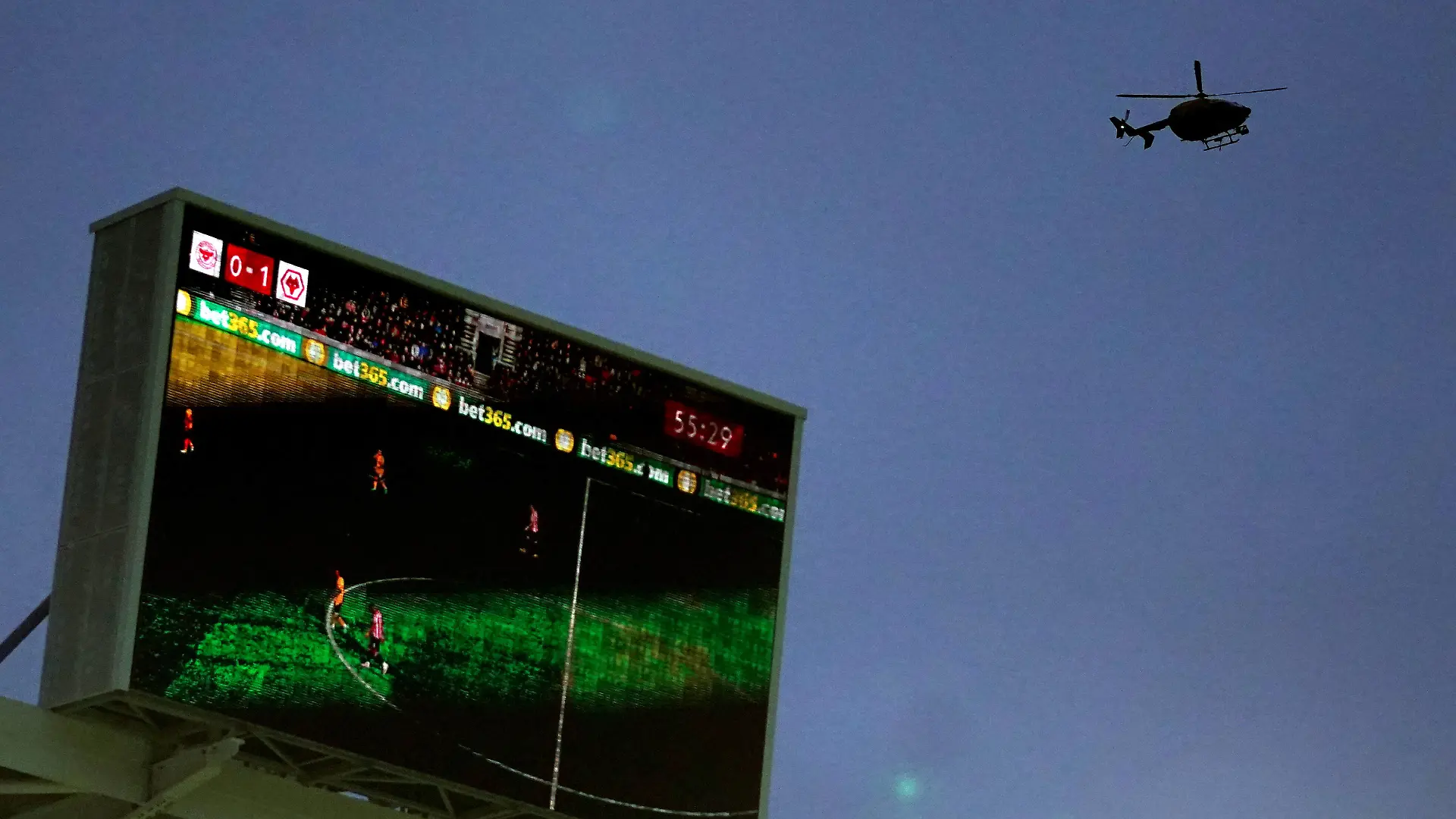 Brentford v Wolverhampton Wanderers - Premier League - Brentford Community Stadium A helicopter hovers above the stadium during the Premier League match at Brentford Community Stadium, London. Picture date: Saturday January 22, 2022. EDITORIAL USE ONLY No use with unauthorised audio, video, data, fixture lists, club/league logos or live services. Online in-match use limited to 120 images, no video emulation. No use in betting, games or single club/league/player publications. PUBLICATIONxNOTxINxUKxIRL Copyright: xNickxPottsx 64882626 