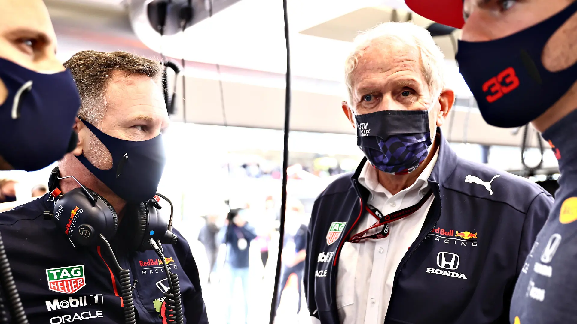 SAO PAULO, BRAZIL - NOVEMBER 13: Red Bull Racing Team Principal Christian Horner, Red Bull Racing Team Consultant Dr Helmut Marko, Max Verstappen of Netherlands and Red Bull Racing and his race engineer Gianpiero Lambiase talk in the garage before the sprint ahead of the F1 Grand Prix of Brazil at Autodromo Jose Carlos Pace on November 13, 2021 in Sao Paulo, Brazil. (Photo by Mark Thompson/Getty Images)