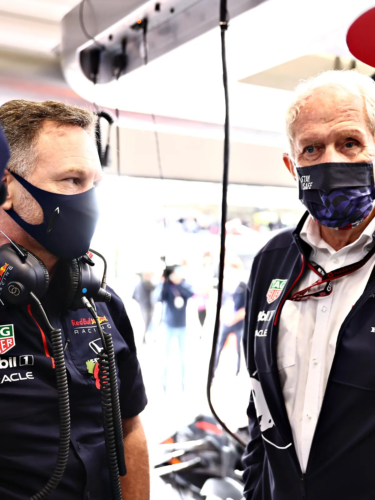 SAO PAULO, BRAZIL - NOVEMBER 13: Red Bull Racing Team Principal Christian Horner, Red Bull Racing Team Consultant Dr Helmut Marko, Max Verstappen of Netherlands and Red Bull Racing and his race engineer Gianpiero Lambiase talk in the garage before  the sprint ahead of the F1 Grand Prix of Brazil at Autodromo Jose Carlos Pace on November 13, 2021 in Sao Paulo, Brazil. (Photo by Mark Thompson/Getty Images)