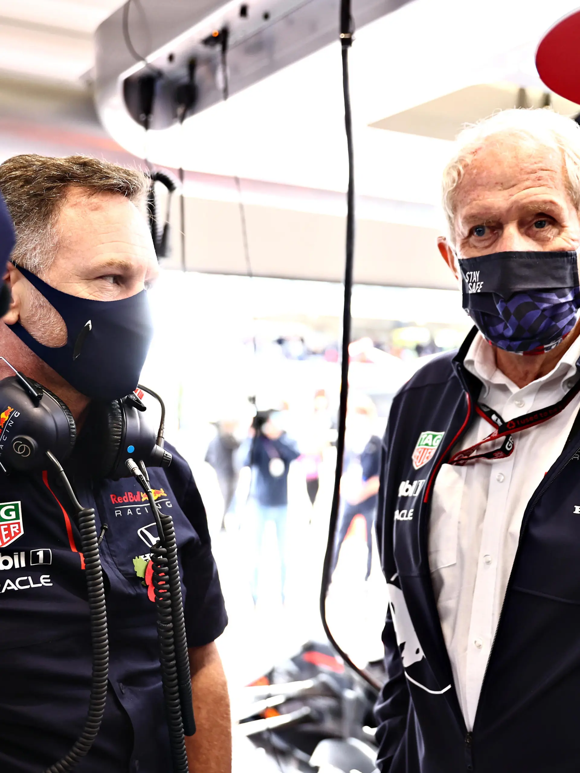 SAO PAULO, BRAZIL - NOVEMBER 13: Red Bull Racing Team Principal Christian Horner, Red Bull Racing Team Consultant Dr Helmut Marko, Max Verstappen of Netherlands and Red Bull Racing and his race engineer Gianpiero Lambiase talk in the garage before  the sprint ahead of the F1 Grand Prix of Brazil at Autodromo Jose Carlos Pace on November 13, 2021 in Sao Paulo, Brazil. (Photo by Mark Thompson/Getty Images)