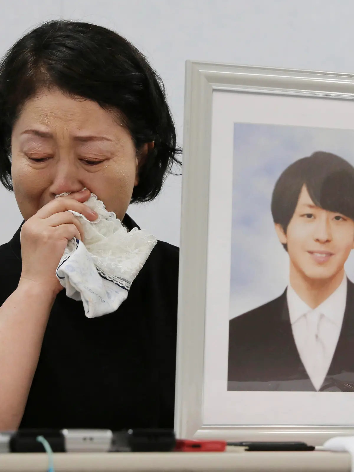 Junko Takashima, a mother of Shingo Takashima who is a male intern doctor at the Konan Medical Center and committed suicide in May last year, attends a press conference at Osaka District Court in Osaka City, Osaka Prefecture on August 18, 2023. The Labor Standards Inspection Office recognized that the cause was a mental disorder caused by working long hours. The intern doctor Shingo Takashima had no days off for about three months before his suicide, and had worked 207 hours of overtime per month, far exceeding the government's standard for recognition. Konan Medical Center Director Eisei Gu has denies that the center ordered him to work long hours.( The Yomiuri Shimbun via AP Images )