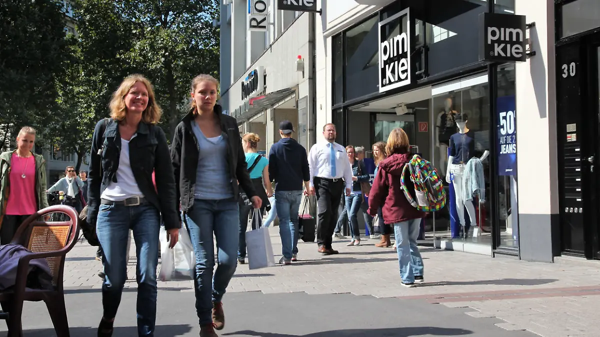 People visit fashion shops in Spitalerstrasse street, Hamburg. The pedestrianized Spitalerstrasse is one of most popular shopping streets in Germany.