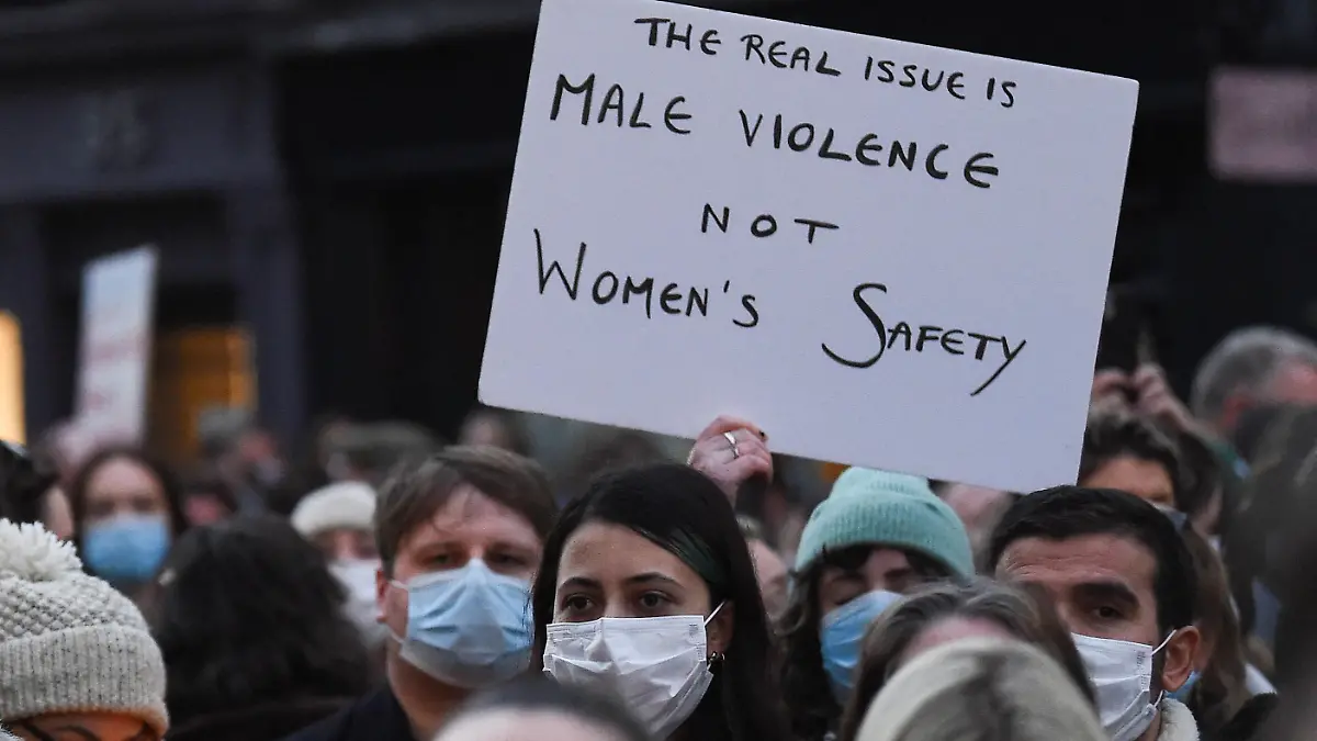 A person holds a sign during a memorial for 23-year-old Ashling Murphy, who was murdered in Tullamore while out jogging, outside Government buildings, in Dublin, Ireland January 14, 2022. REUTERS/Clodagh Kilcoyne