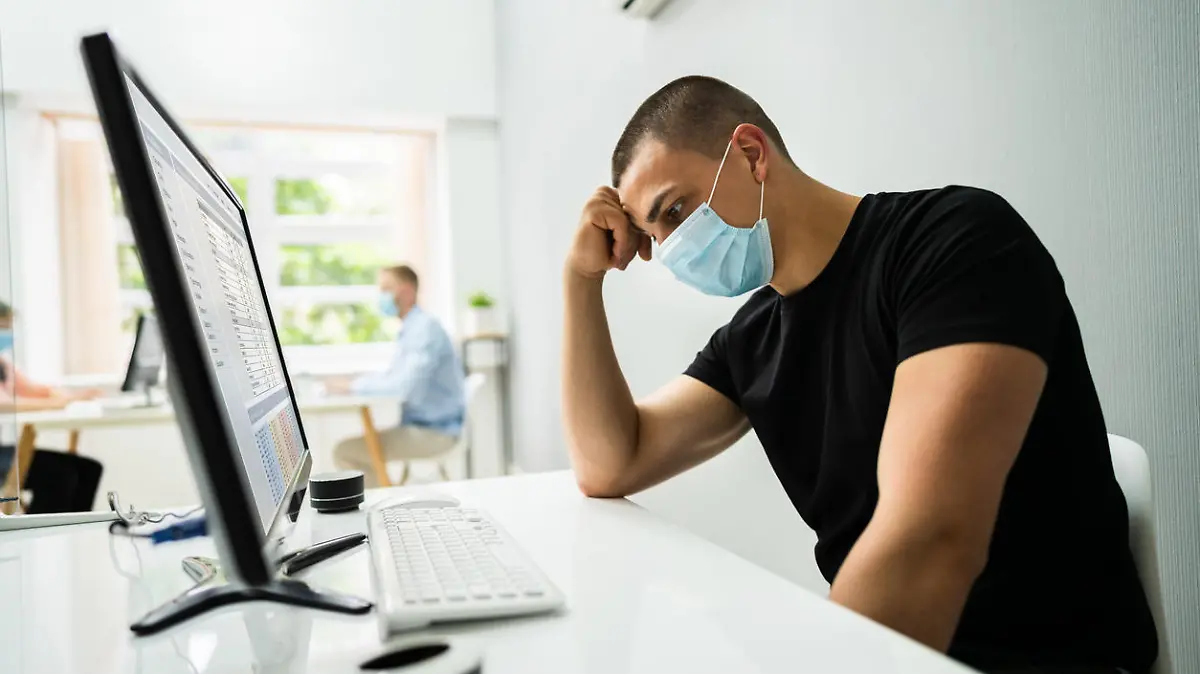 Stressed Employee In Office Wearing Face Mask