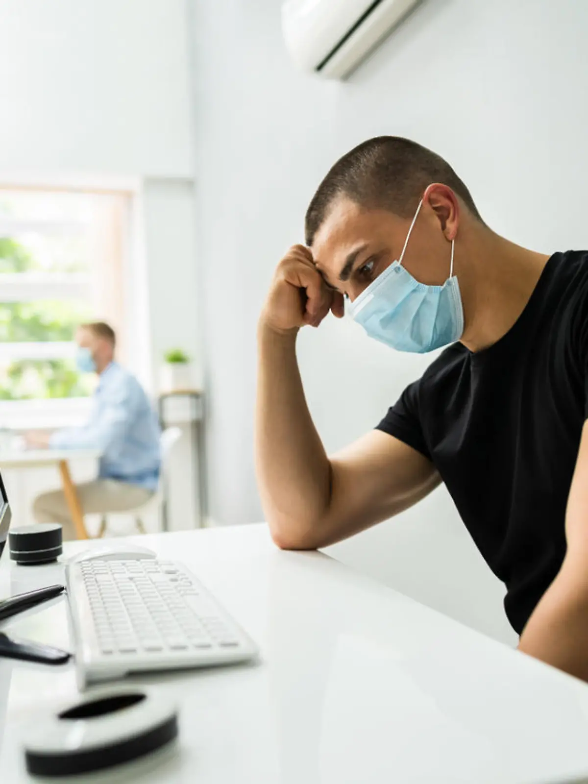 Stressed Employee In Office Wearing Face Mask