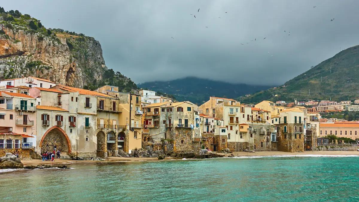 Colorful old houses by the sea in Cefalu in Sicily, Italy