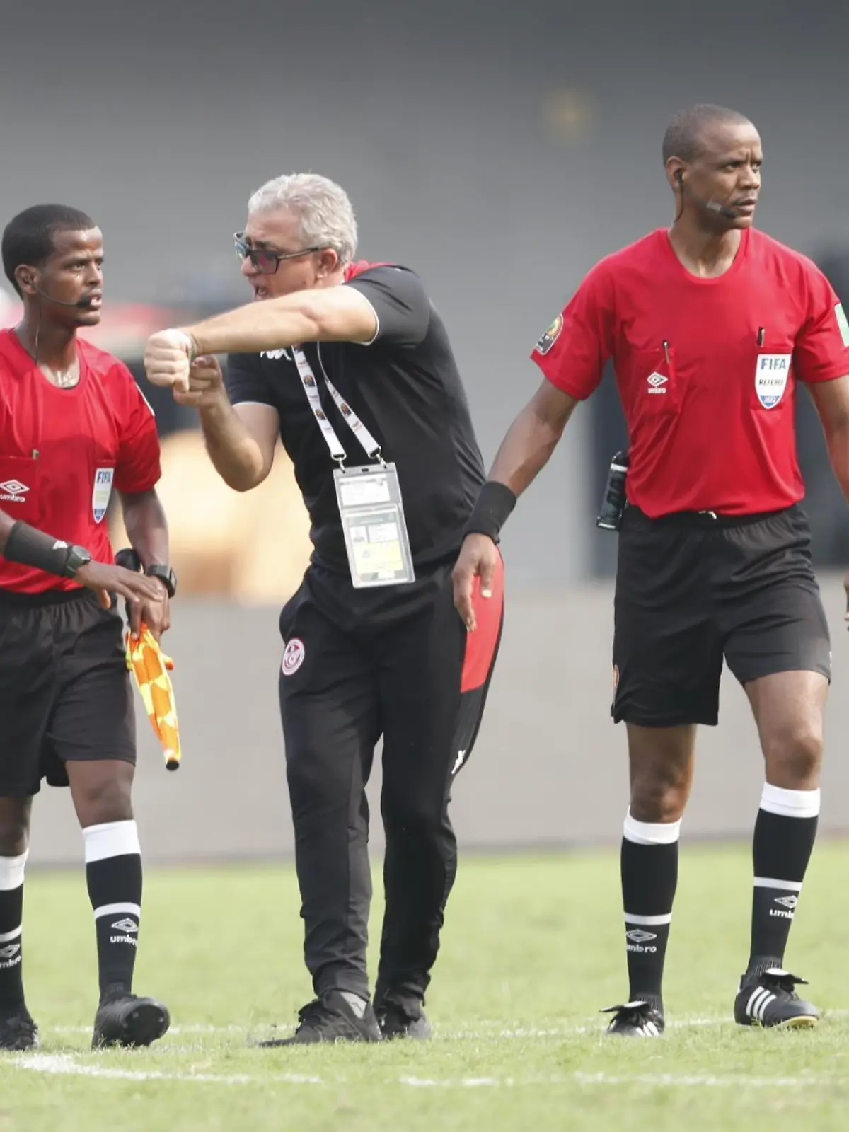 LIMBE, CAMEROON - JANUARY 12: Head coach of Tunisia Mondher Kebaier reacts to the Zambian referee of the match Janny Sikazwe after he finished the 2021 Africa Cup of Nations Group F match between Tunisia and Mali before regular time at Omnisport Stadium in Limbe, Cameroon on January 12, 2022. Haykel Hmima / Anadolu Agency