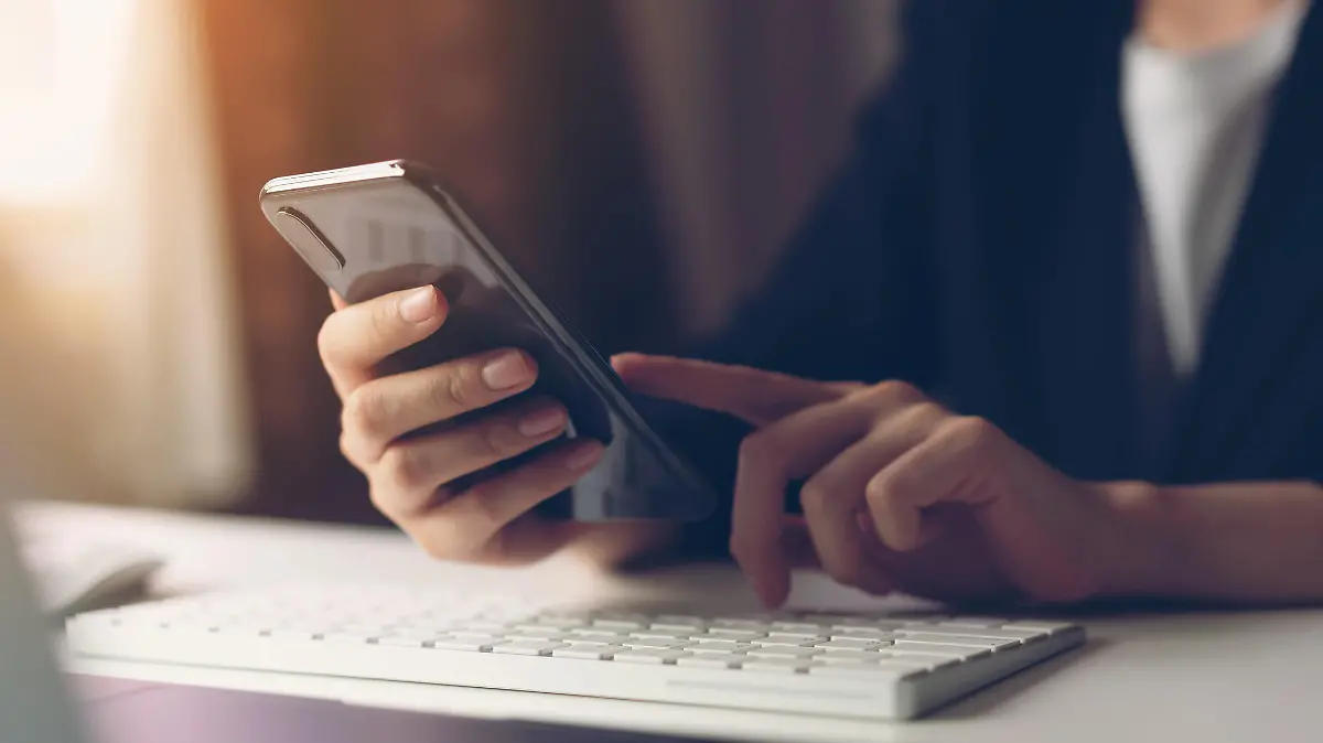 Woman using smartphone. The concept of using the phone is essential in everyday life.