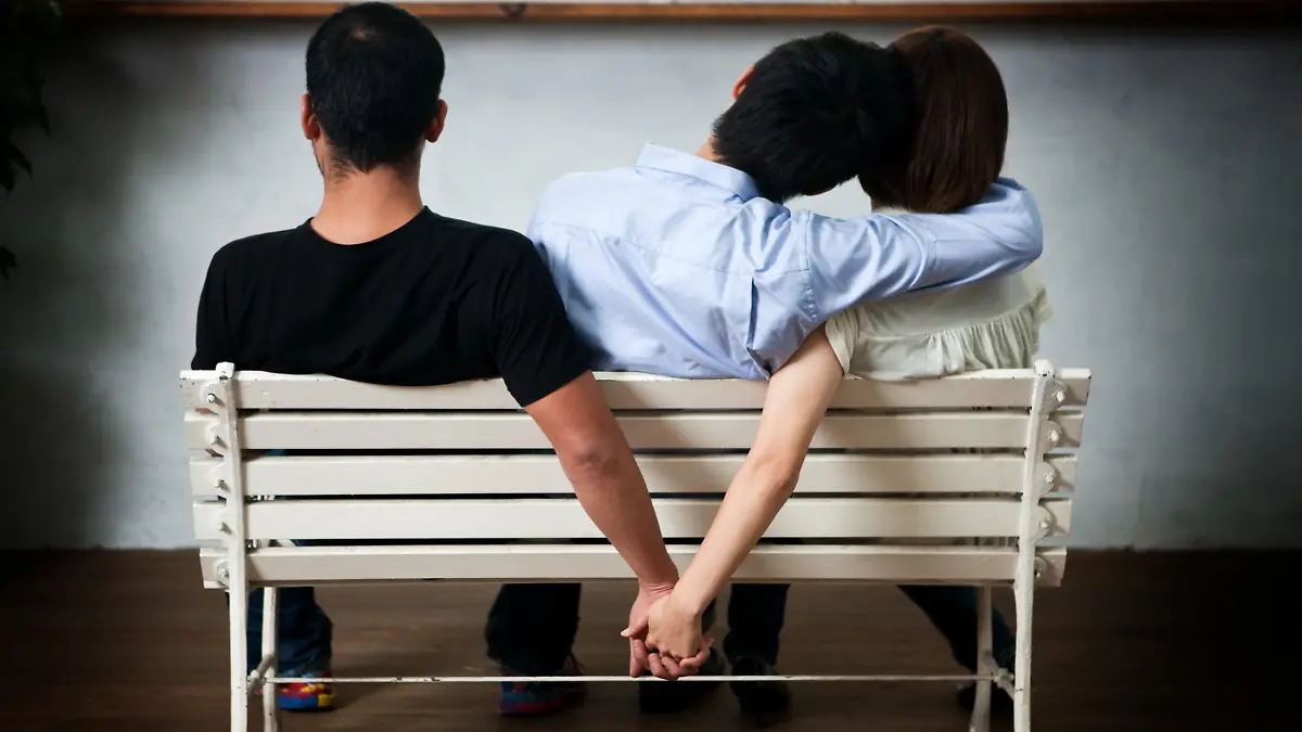 Young woman and man holding their hands behind the seat