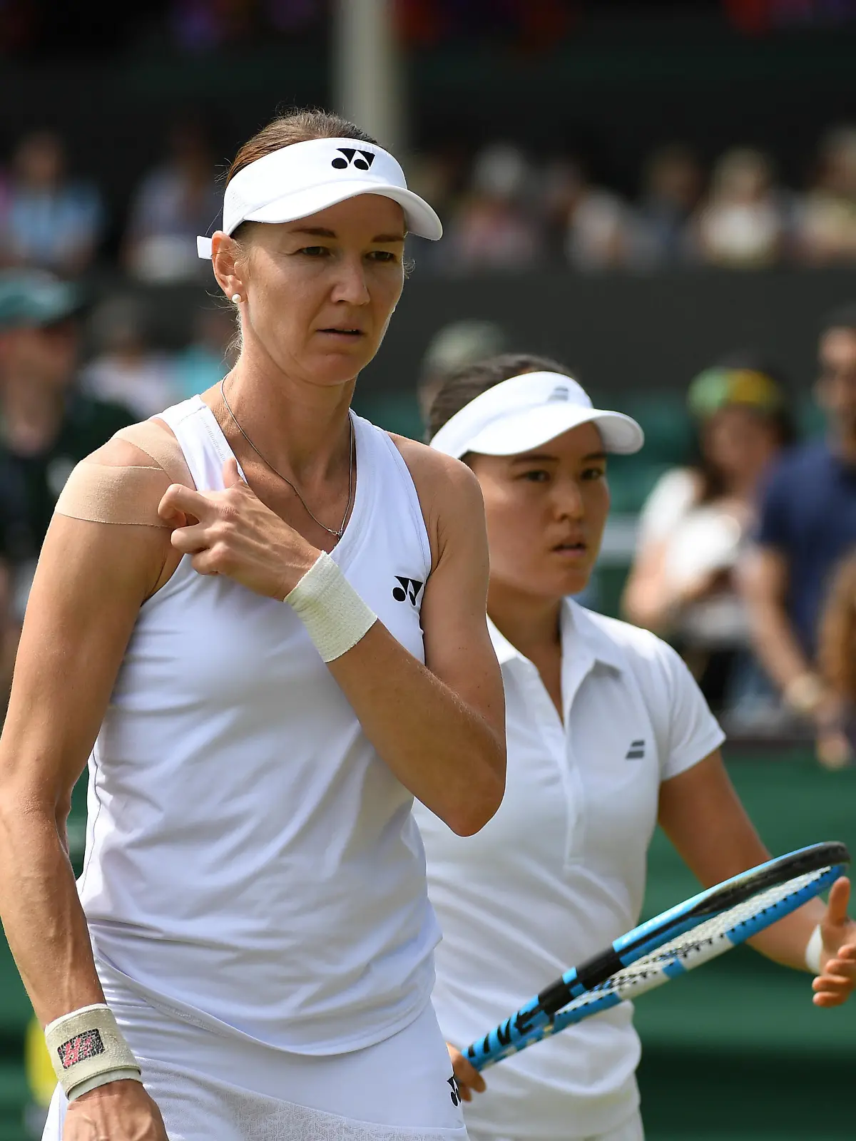 (190705) -- LONDON, July 5, 2019 (Xinhua) -- Ninomiya Makoto/Renata Voracova (L) react during the women's doubles second round match against China's Zheng Saisai and Duan Yingying at the 2019 Wimbledon Tennis Championships in London, Britain, on July 5, 2019. (Xinhua/Lu Yang)