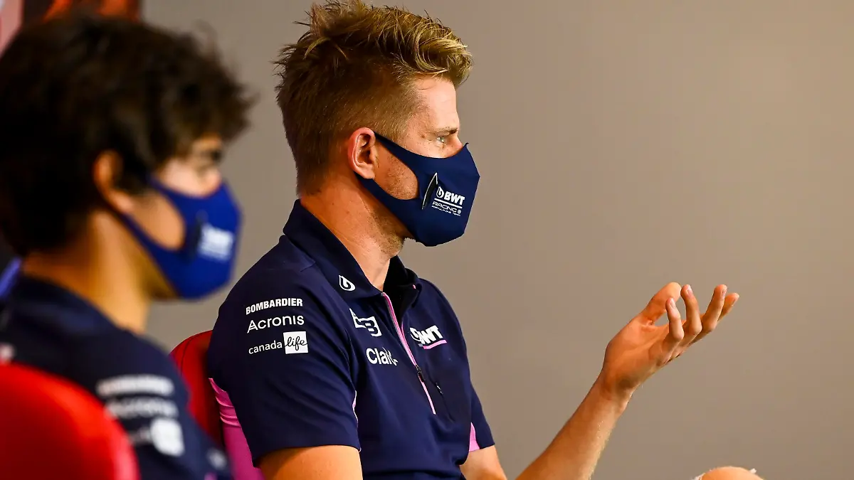 Racing Point driver Nico Hulkenberg of Germany, right, and Racing Point driver Lance Stroll of Canada attend the press conference in the build-up to the 70th Anniversary Formula One Grand Prix at the Silverstone circuit, Silverstone, England, Thursday, Aug. 6, 2020.(Mark Sutton/Pool via AP)