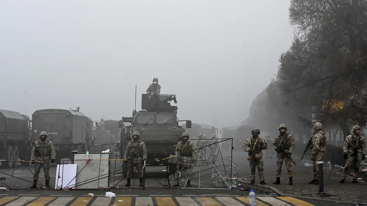 Troops are seen at the main square where hundreds of people were protesting against the government, after authorities' decision to lift price caps on liquefied petroleum gas, in Almaty, Kazakhstan January 6, 2022. REUTERS/Mariya Gordeyeva
