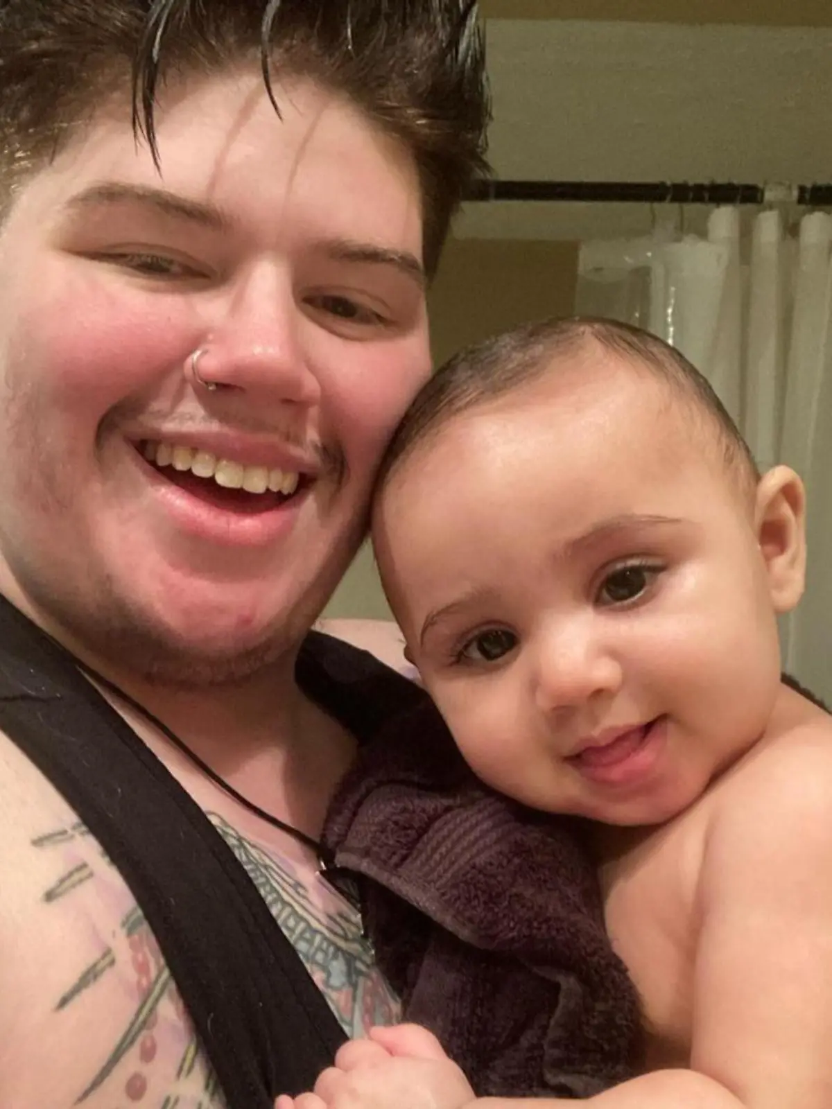 MERCURY PRESS. (Pictured: Ash Patrick Schade, 28, with son Ronan.) A trans man has revealed how he fell pregnant whilst transitioning after a one-night stand. Ash Patrick Schade, 28, had spent the last two years transitioning and taking testosterone and oestrogen blockers when he discovered that he was pregnant in February 2020 after a 'Grindr hook-up'. The mental health worker and PHD student from Huntington, West Virginia, USA was shocked at the revelation, but paused hormone treatments immediately in order to give birth to his daughter, Ronan Shiva, one. SEE MERCURY COPY