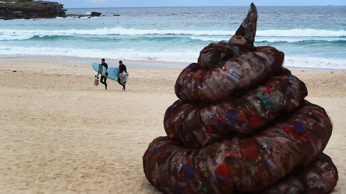 SYDNEY, AUSTRALIA - JUNE 05: A sculpture titled 'Plastic pile of sh!t, 2023' presented by Better Packaging Co. is seen on display at Bondi Beach on June 05, 2023 in Sydney, Australia. The four-metre-high sculpture is made out of recycled plastic and resembles human feces. The sculpture is designed to draw attention to the amount of plastic that's dumped in the world's oceans every 30 seconds. (Photo by Lisa Maree Williams/Getty Images)