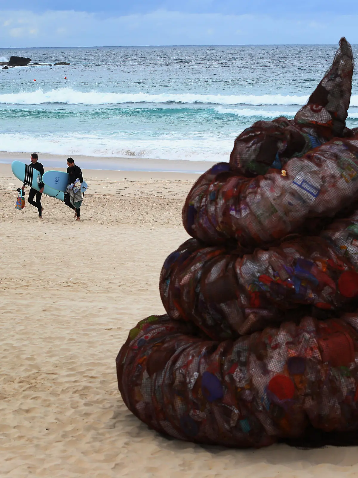 SYDNEY, AUSTRALIA - JUNE 05: A sculpture titled 'Plastic pile of sh!t, 2023' presented by Better Packaging Co. is seen on display at Bondi Beach on June 05, 2023 in Sydney, Australia. The four-metre-high sculpture is made out of recycled plastic and resembles human feces. The sculpture is designed to draw attention to the amount of plastic that's dumped in the world's oceans every 30 seconds. (Photo by Lisa Maree Williams/Getty Images)