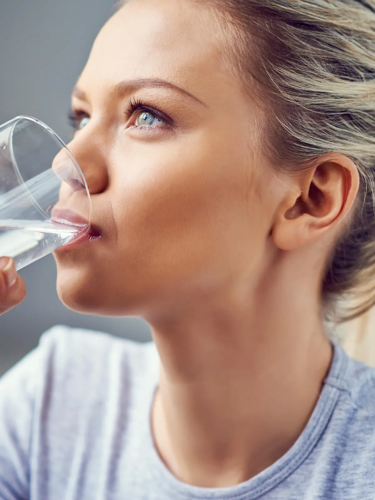 Young woman drinking purified water
