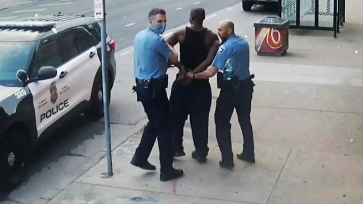 FILE - This image from video shows Minneapolis police Officers Thomas Lane, left and J. Alexander Kueng, right, escorting George Floyd, center, to a police vehicle outside Cup Foods in Minneapolis, on May 25, 2020. Derek Chauvin, who has already been convicted of state murder and manslaughter charges in the death of Floyd, appears to be on the verge of pleading guilty to violating Floyd's civil rights. Chauvin, Lane, Kueng and Tou Thao were set to go to trial in late January 2022 on those federal charges. (Court TV via AP, Pool, File)