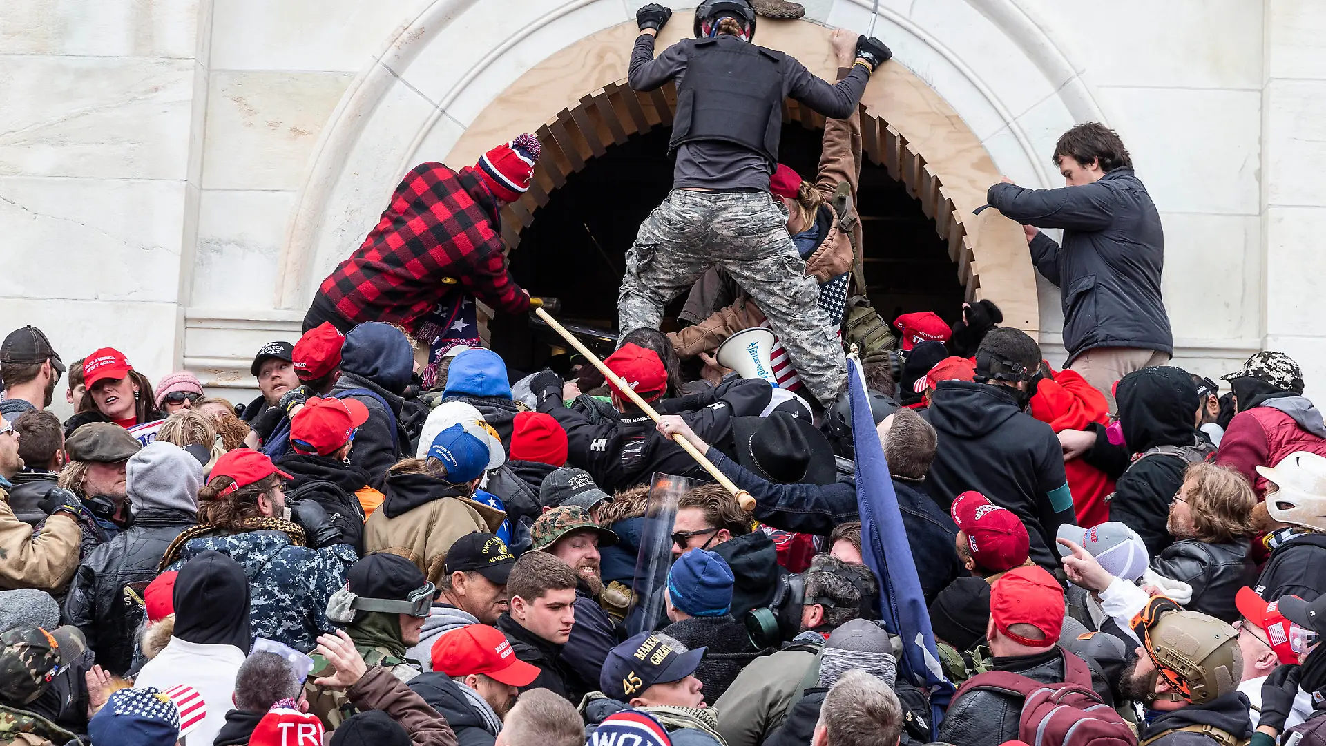  Pro-Trump Riot in Washington DC Rioters clash with police trying to enter Capitol building through the front doors. Rioters broke windows and breached the Capitol building in an attempt to overthrow the results of the 2020 election. Police used buttons and tear gas grenades to eventually disperse the crowd. Rioters used metal bars and tear gas as well against the police. Washington DC District of Columbia United States Copyright: LevxRadin
