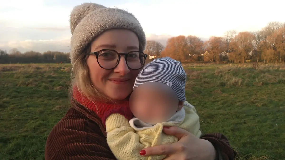 PIC FROM Kennedy News and Media (PICTURED: MUM JULIA COOPER, 32, FROM CHORLTON, GREATER MANCHESTER, WITH NINE-MONTH-OLD DAUGHTER) A new mum claims a 'creepy' bloke refused to delete photos he had taken of her BREASTFEEDING when she confronted him - while police refused to do anything as she had been 'in public'. Julia Cooper says that despite 'being discrete' and wearing a large coat when she breastfed her nine-month-old daughter on a bench while out for a walk with friends in Sale, Greater Manchester, she noticed a man staring a her. The 32-year-old claims the man, who was sat at a nearby picnic table, attached a zoom lens to his camera and began taking pictures of her, trying to get a close-up of 'what was going on'. DISCLAIMER: While Kennedy News and Media uses its best endeavours to establish the copyright and authenticity of all pictures supplied, it accepts no liability for any damage, loss or legal action caused by the use of images supplied and the publication of images is solely at your discretion. SEE KENNEDY NEWS COPY - 0161 697 4266.