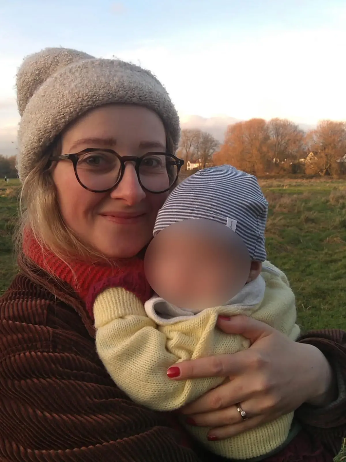 PIC FROM Kennedy News and Media (PICTURED: MUM JULIA COOPER, 32, FROM CHORLTON, GREATER MANCHESTER, WITH NINE-MONTH-OLD DAUGHTER) A new mum claims a 'creepy' bloke refused to delete photos he had taken of her BREASTFEEDING when she confronted him - while police refused to do anything as she had been 'in public'. Julia Cooper says that despite 'being discrete' and wearing a large coat when she breastfed her nine-month-old daughter on a bench while out for a walk with friends in Sale, Greater Manchester, she noticed a man staring a her. The 32-year-old claims the man, who was sat at a nearby picnic table, attached a zoom lens to his camera and began taking pictures of her, trying to get a close-up of 'what was going on'. DISCLAIMER: While Kennedy News and Media uses its best endeavours to establish the copyright and authenticity of all pictures supplied, it accepts no liability for any damage, loss or legal action caused by the use of images supplied and the publication of images is solely at your discretion. SEE KENNEDY NEWS COPY - 0161 697 4266.