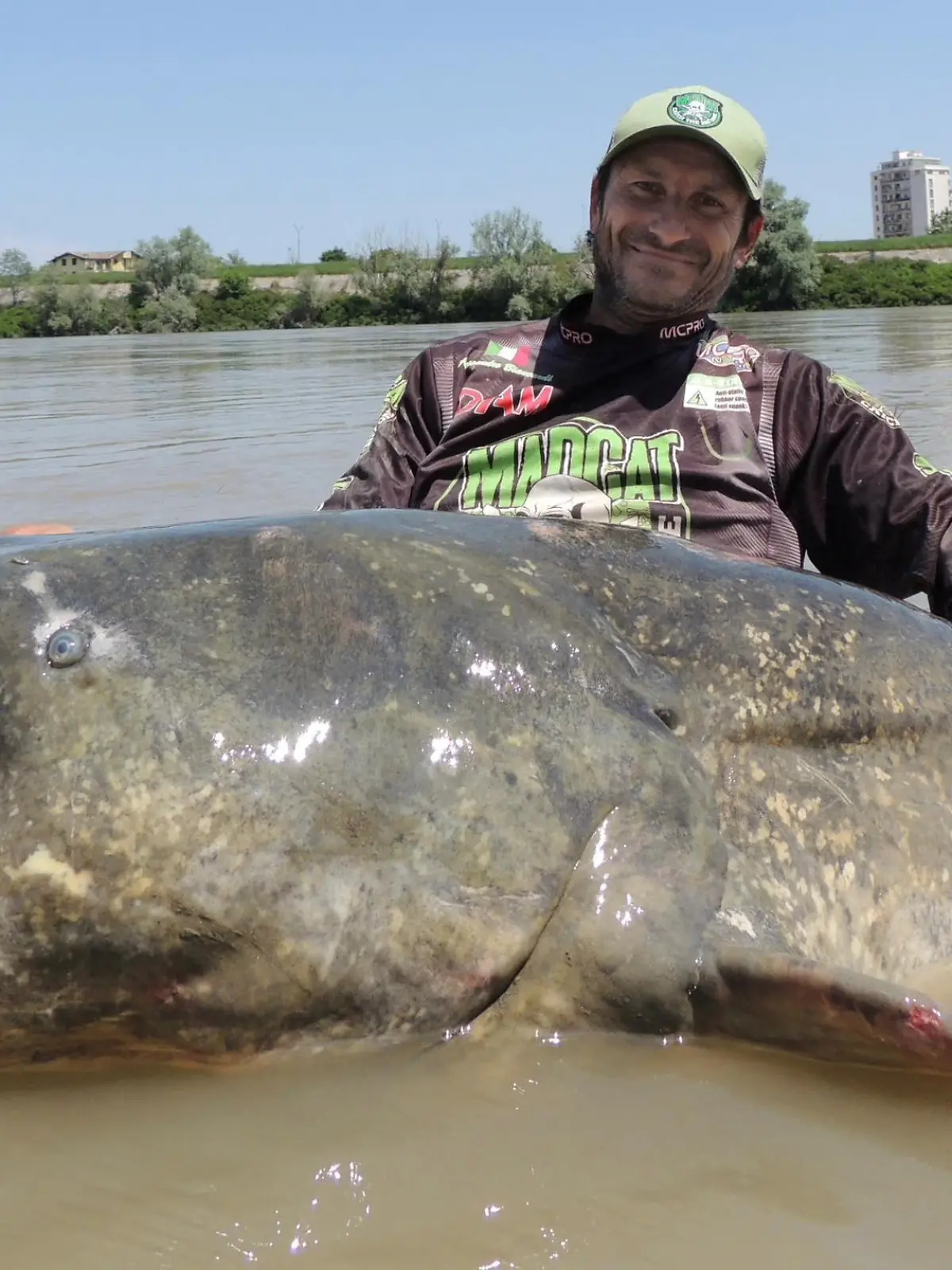  A person holds a giant catfish in Mantua, Italy, May 25, 2023, in this picture obtained from social Media. Alessandro Biancardi Madcat/via REUTERS  THIS IMAGE HAS BEEN SUPPLIED BY A THIRD PARTY. MANDATORY CREDIT. NO RESALES. NO ARCHIVES.