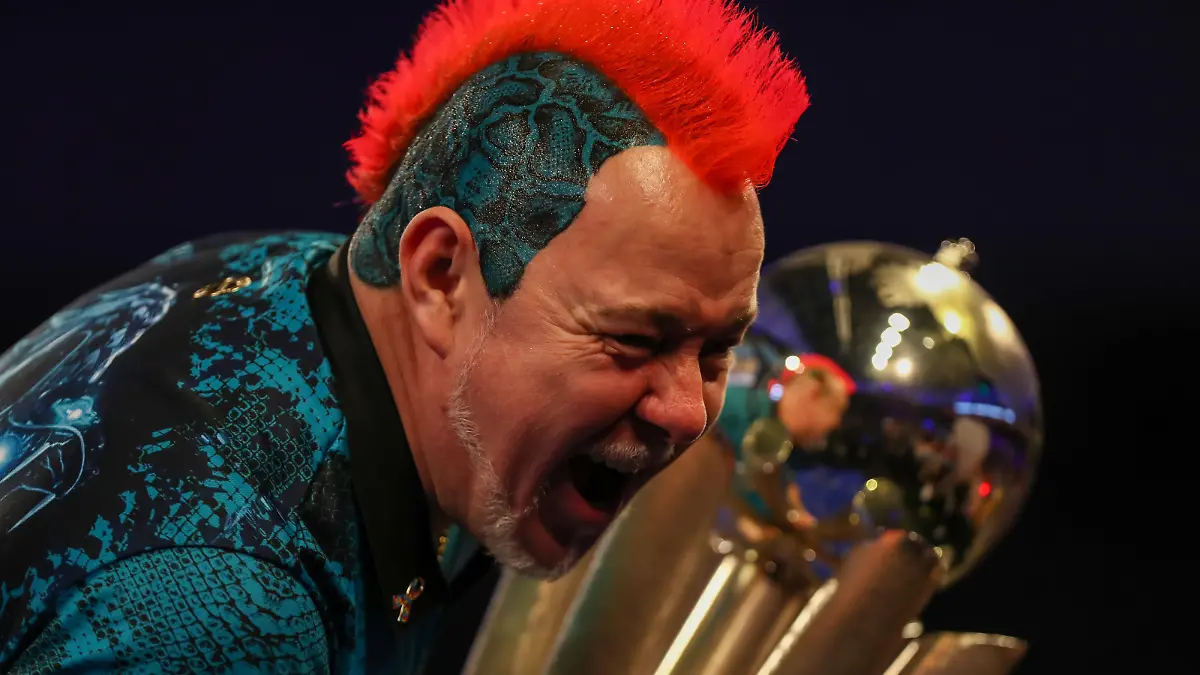 3rd January 2022: Alexandra Palace, London, England: The William Hill World Darts Tournament final between Peter Wright and Michael Smith; Peter Wright celebrates with the PDC World/William Hill Dart Championship trophy