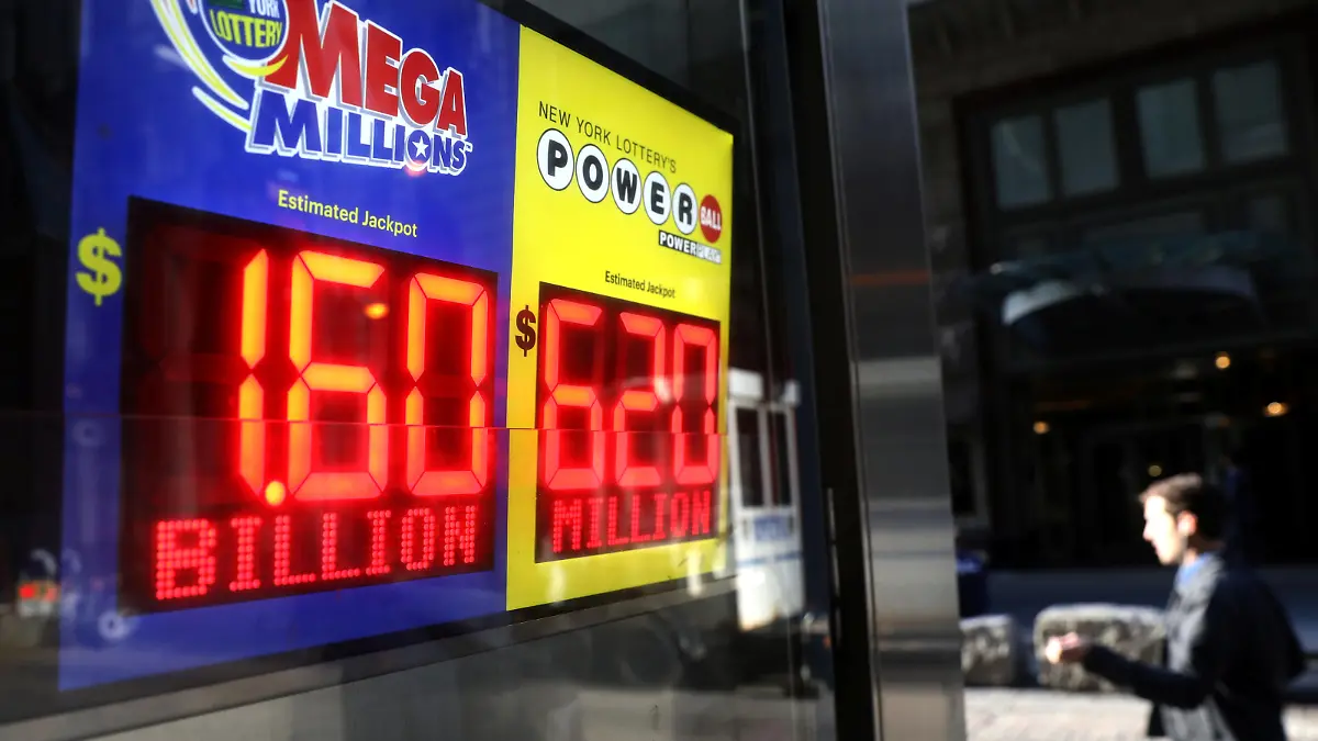 Signs display the jackpots for Tuesday's Mega Millions and Wednesday's Powerball lottery drawings in New York City, New York, U.S., October 23, 2018. REUTERS/Mike Segar