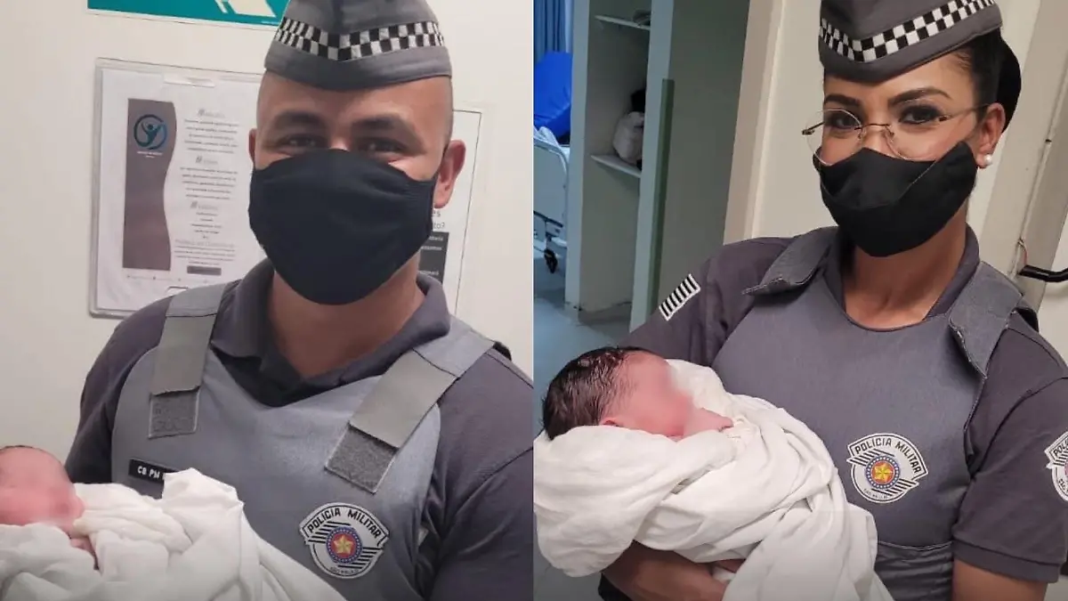 Zwei Polizisten mit Baby im Arm