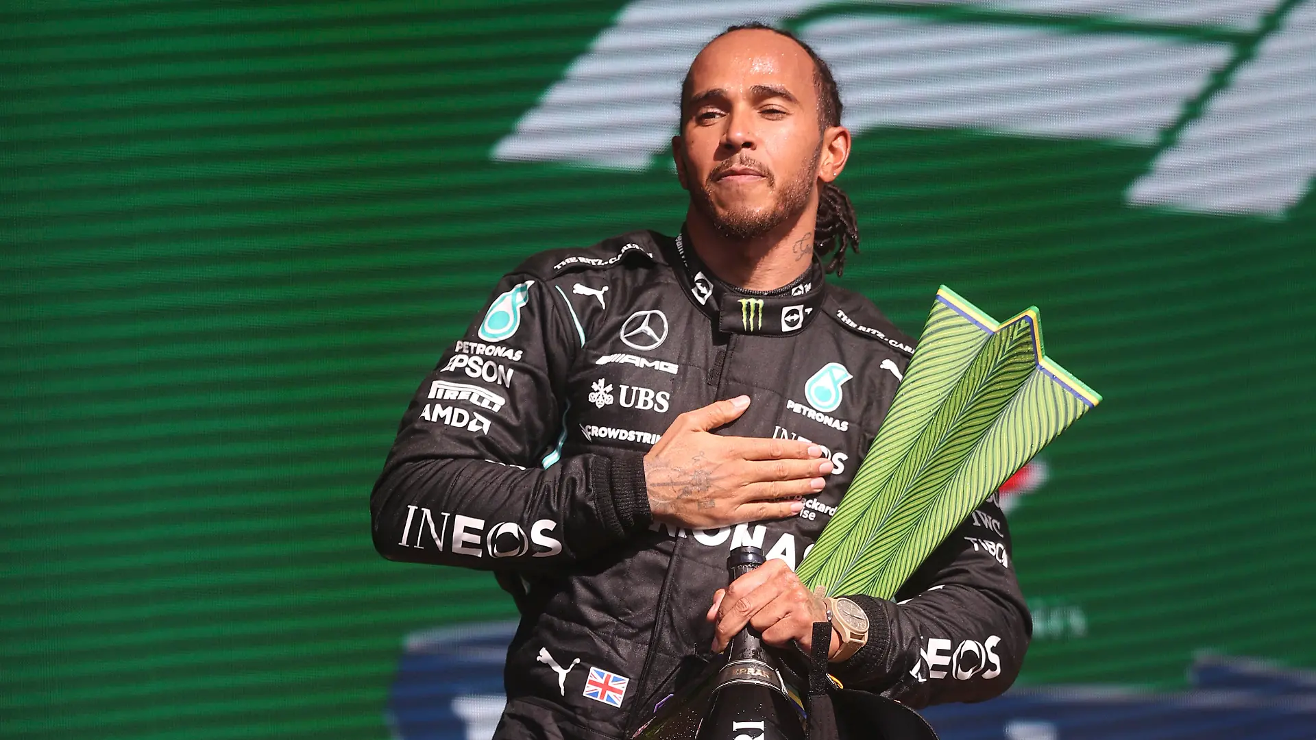 Mercedes driver Lewis Hamilton, of Britain, celebrates his first place victory in the Brazilian Formula One Grand Prix in Sao Paulo, Brazil, Sunday, Nov. 14, 2021. (Lars Baron, Pool Photo via AP)