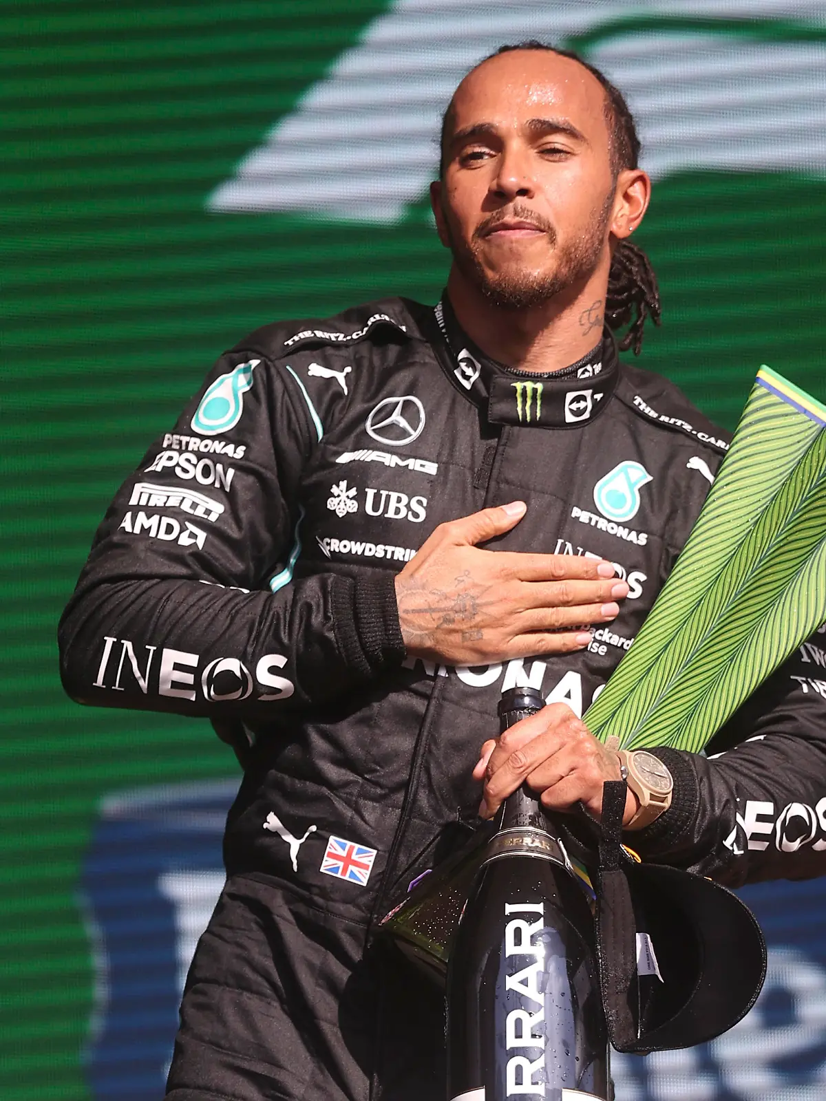 Mercedes driver Lewis Hamilton, of Britain, celebrates his first place victory in the Brazilian Formula One Grand Prix in Sao Paulo, Brazil, Sunday, Nov. 14, 2021. (Lars Baron, Pool Photo via AP)