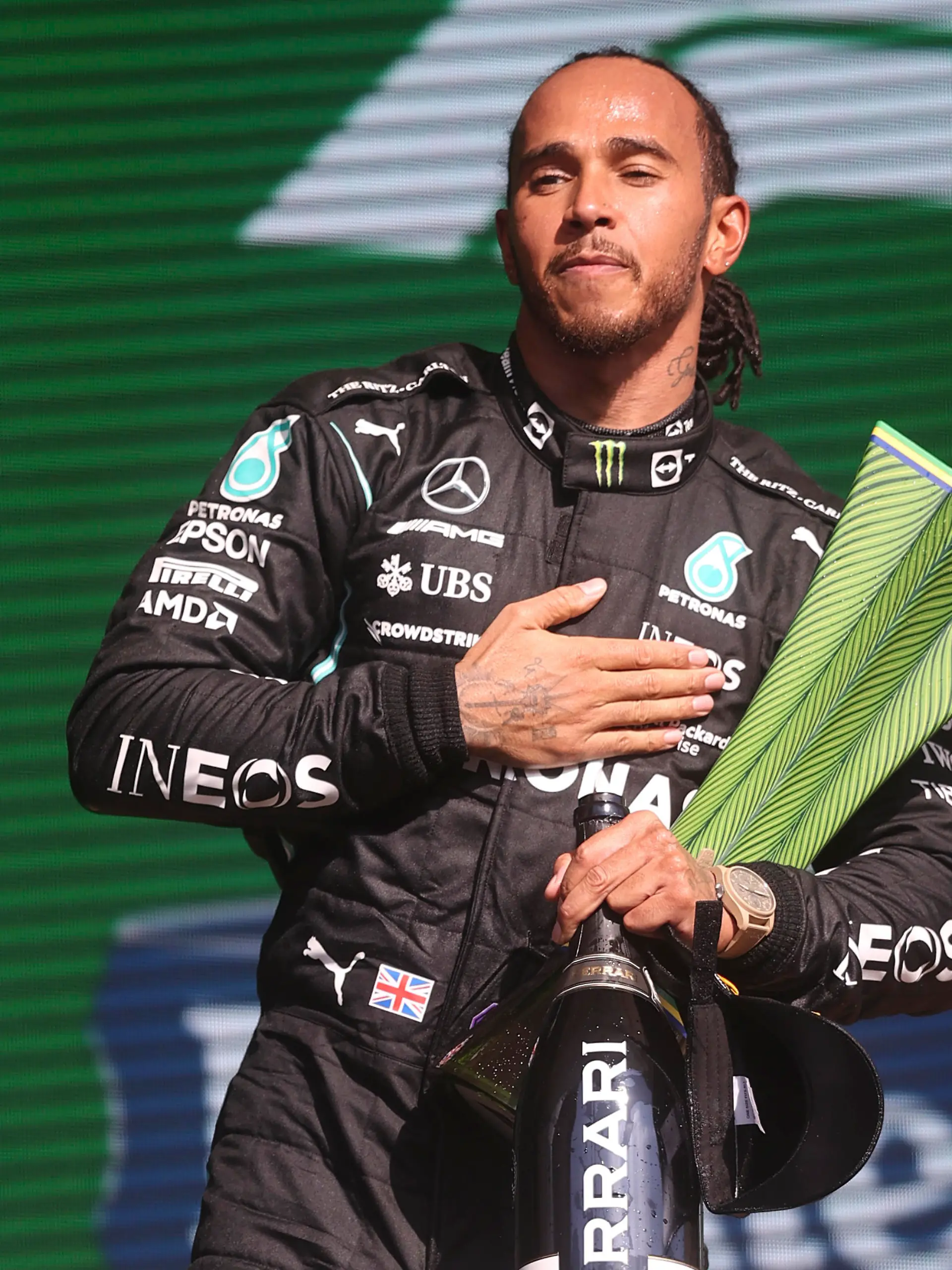 Mercedes driver Lewis Hamilton, of Britain, celebrates his first place victory in the Brazilian Formula One Grand Prix in Sao Paulo, Brazil, Sunday, Nov. 14, 2021. (Lars Baron, Pool Photo via AP)