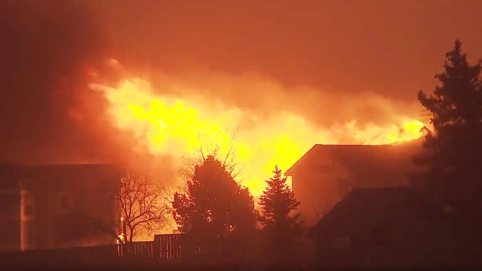 A house burns as a wind-driven wildfire forced evacuation of the Superior suburb of Boulder, Colorado, U.S. December 30,2021 in this still image obtained from a social media video. Eric English/via REUTERS THIS IMAGE HAS BEEN SUPPLIED BY A THIRD PARTY. MANDATORY CREDIT. NO RESALES. NO ARCHIVES.