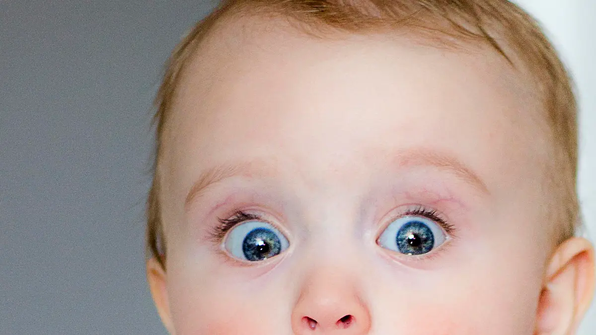 child's eyes widened and mouth opened in amazement. copy space for your text