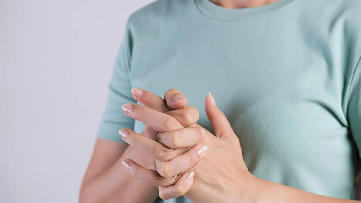 Healthcare and medical concept. Close up woman cracking knuckles.
