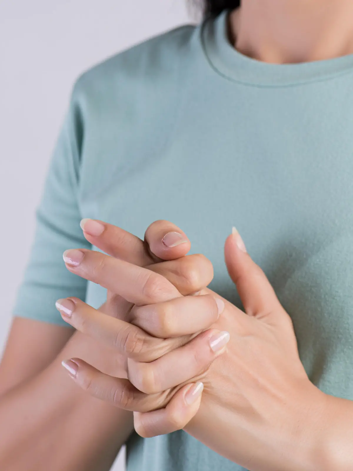 Healthcare and medical concept. Close up woman cracking knuckles.