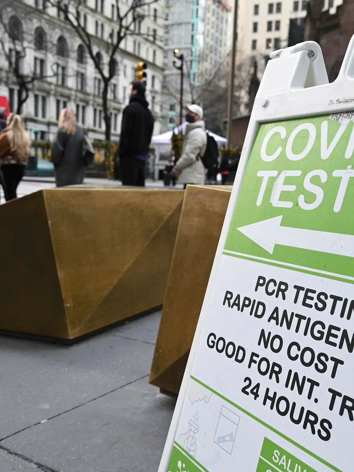 Photo by: NDZ/STAR MAX/IPx 2021 12/16/21 People wait in line to receive a COVID-19 test at a mobile COVID-19 testing site in the Financial District of Manhattan on December 8, 2021 in New York.